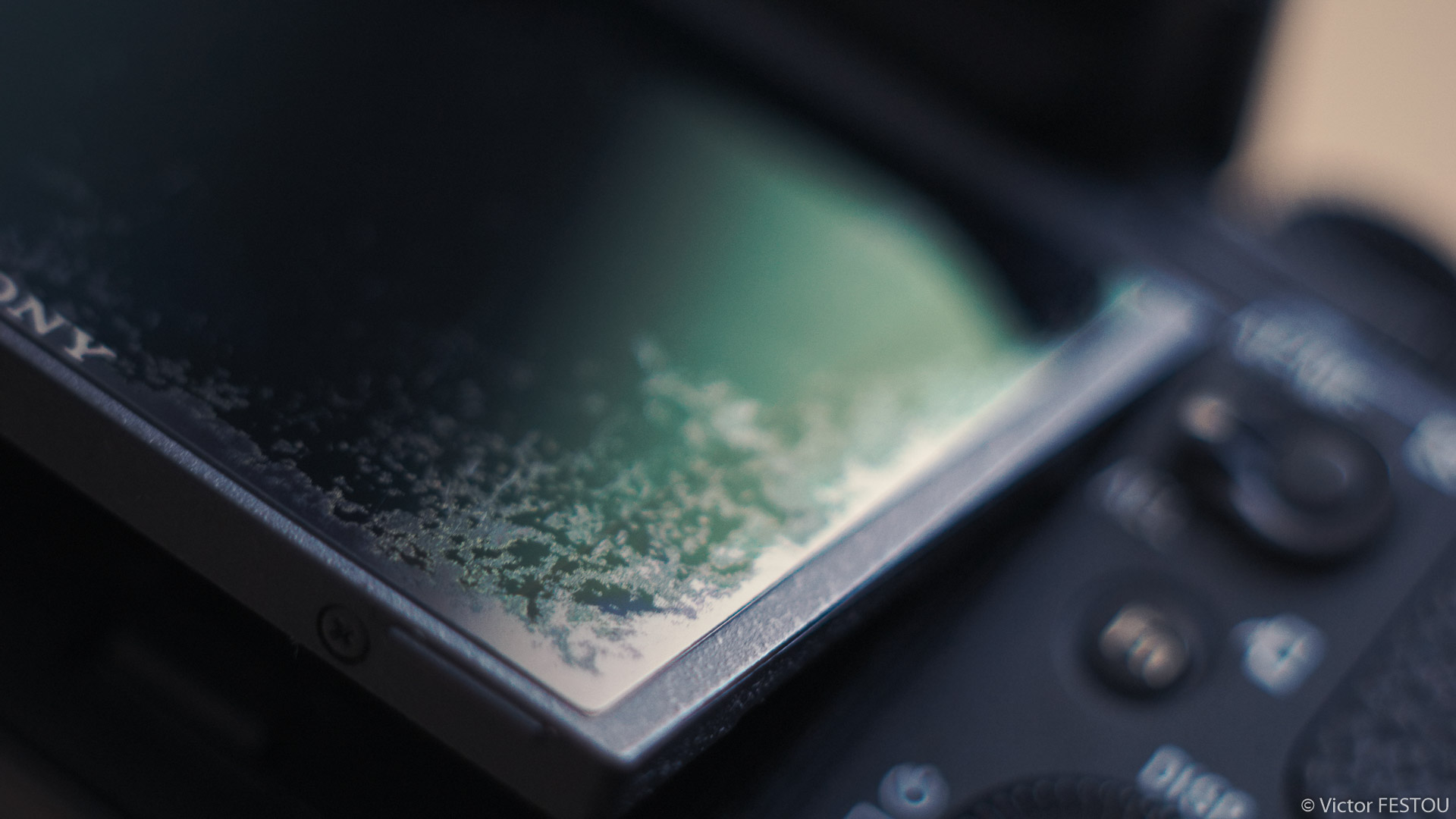 Close up of the damaged LCD factory protector on a sony a7r2